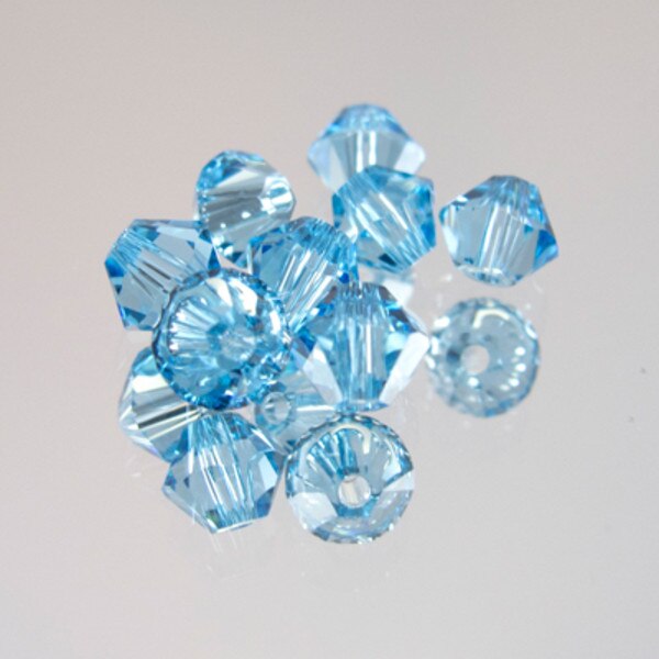 45-1101.SLC.jpg SwarovskiBiconeAquamarine4mm72pk Image