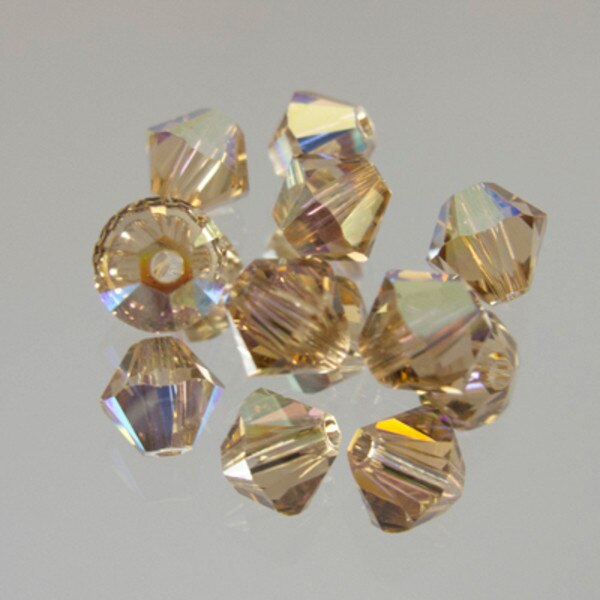 45-1159.SLC.jpg SwarovskiBiconeLtCoTopAB4mm72pk Image