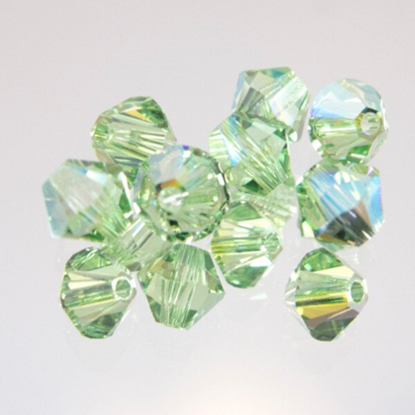 45-1168.SLC.jpg SwarovskiBiconePeridotAB4mm72pk Image