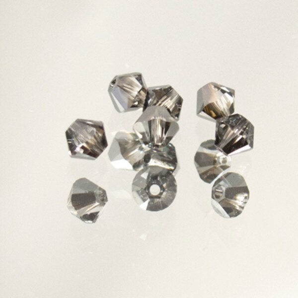 45-1206.SLC.jpg SwarovskiBiconeCrysSlvNt4mm72pk Image
