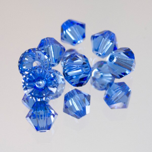 45-1215.SLC.jpg SwarovskiBiconeSapphire4mm72pk Image