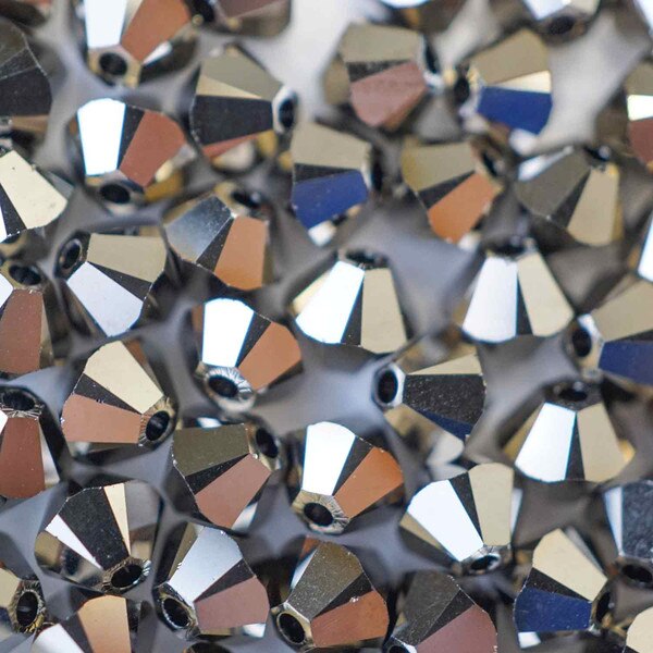 45-1227.SLC.01.jpg SwarovskiBiconeCryMtlGold2X4mm72pk Image